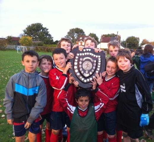 Year 6 Boys' winning team with the trophy